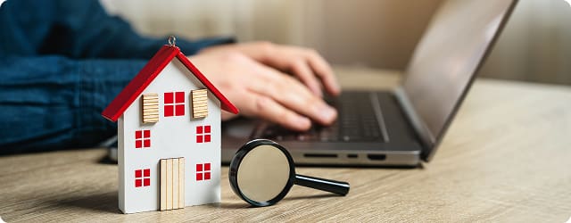 Home inspector using a laptop